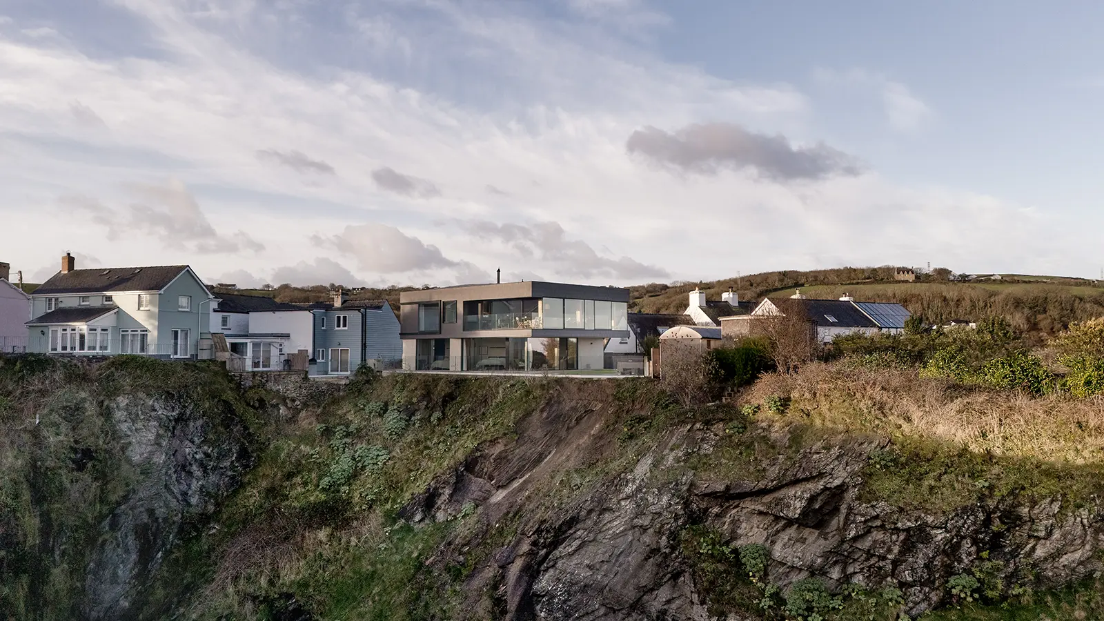 Precariously positioned near the edge of a sheer granite cliff, on the edge of Wales
